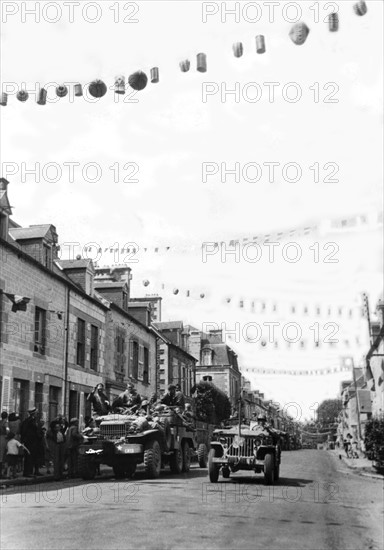 French civilians welcome U.S. troops in Fougeres, Summer 1944