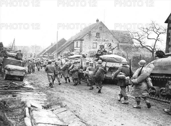 American troops move to the front in Lohr, November 1944