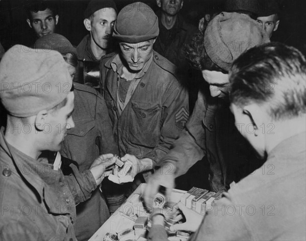 Escaped U.S. captives receive First American cigarets, April 1945