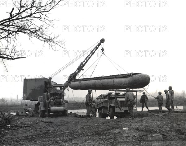 A treadway ponton is used during attemps to bridge Roer river, February 24, 1945