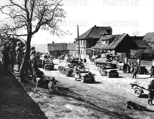 German civilians watch 9th U.S. Army troops during their drive to Elbe river (April 1945)