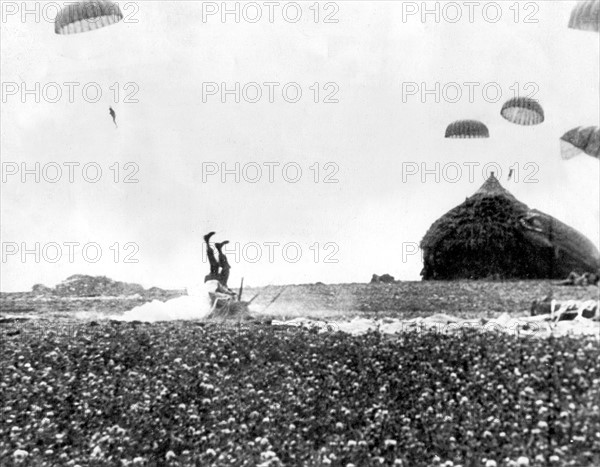 An American paratrooper misses a comfortable haystack in Holland (September 17, 1944)