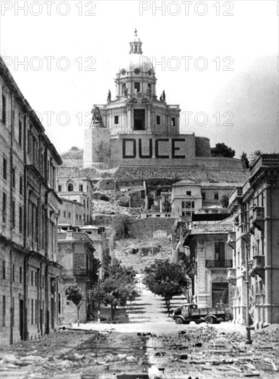 Debris litters the streets of Messina after the fall of  Sicily (August 20, 1943).