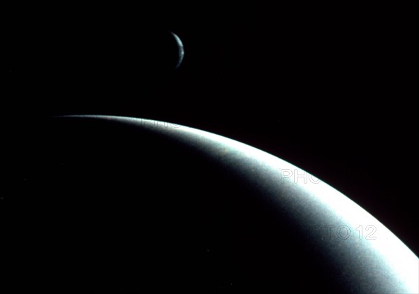 Crescents of Neptune and Triton by Voyager II spacecraft (August 29, 1989).