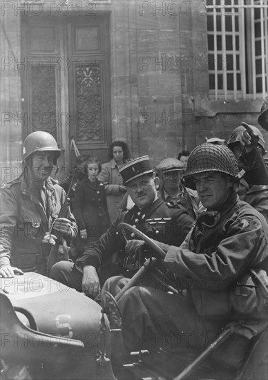American soldiers with a Gendarme (1944)