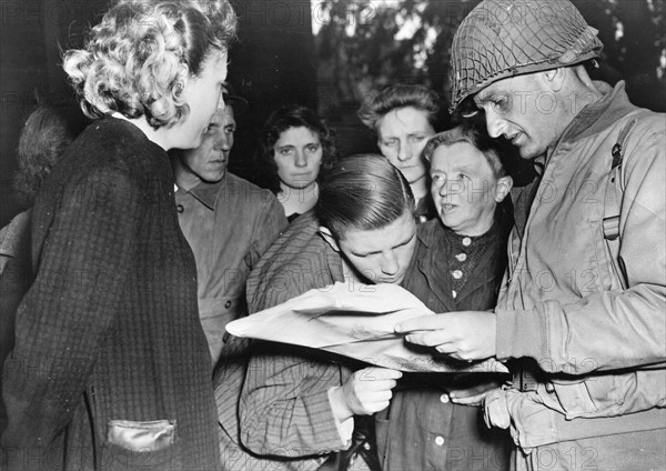 Inhabitants of Cherboug with an American Officer (June 1944)
