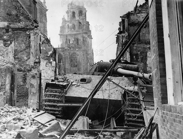 A German 'Tiger' tank destroyed in the ruins of Argentan (Normandy, 1944)