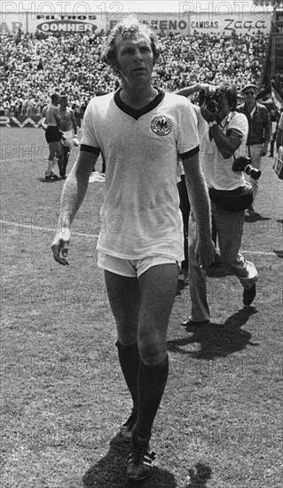 English defender and team captain Bobby Moore wears the tricot of the German soccer team and walks disappointed off the pitch after the 1970 World Cup quarter final Germany against England in Leon, Mexico, 14 June 1970. After a game time of 90 minutes the score was 2-2. In the end Germany wins the game 3-2 against the titleholder England on extra time and qualifies for the semifinals.
