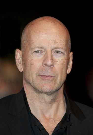 Bruce Willis with Dame Helen Mirren arriving for the European  Premiere of the film RED at the Royal Festival Hall, London.