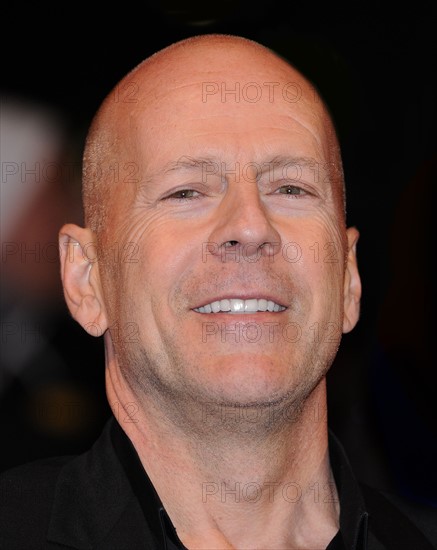 Bruce Willis with Dame Helen Mirren arriving for the European  Premiere of the film RED at the Royal Festival Hall, London.