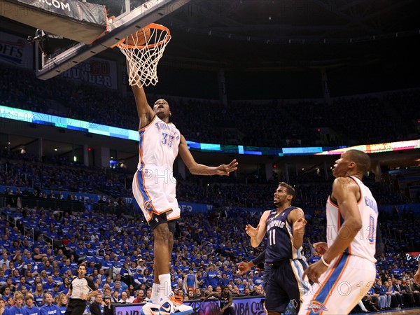 01 May 2011: Thunder forward Kevin Durant (35) dunks over Memphis guard Mike Conley (11) during game 1 of the second round of the NBA playoffs where the Oklahoma City Thunder are taking on the Memphis Grizzlies at the Oklahoma City Arena in Oklahoma City, OK.