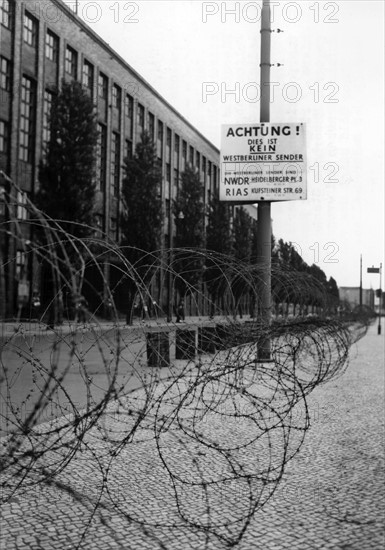 Barbed wire fence in front of sealed off House of Broadcasting in Berlin