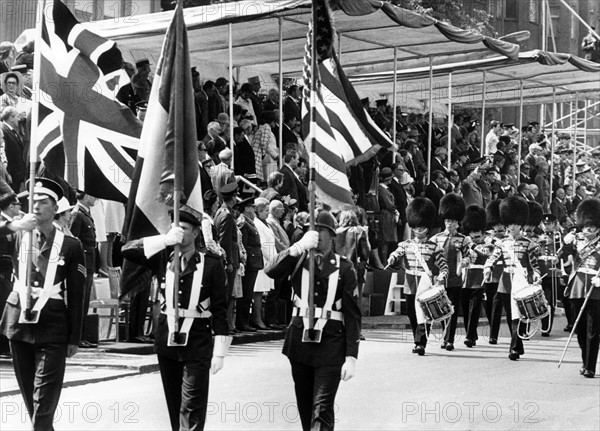 Flag bearers during a military parade at the 'Armed Forces Day' in Berlin