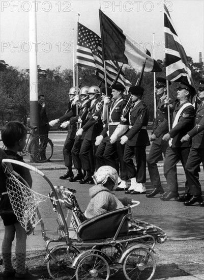 Flag group during military parade for the 'Armed Forces Day' in Berlin