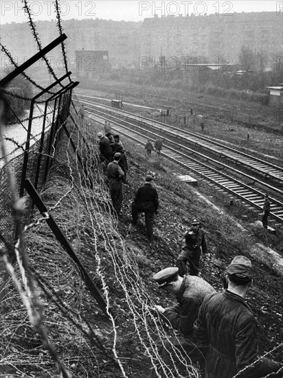 People's Police erect barbed wire at train station Gesundbrunnen in Berlin