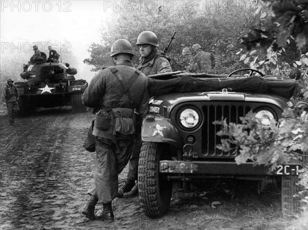 Tank and jeeps in manoeuvre of US army in Berlin Grunewald