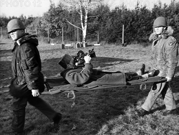 Cameraman on stretcher during emergency response drill of US army