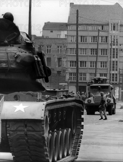 US tank and water-gun vehicle of the People's Police at checkpoint Friedrichstraße