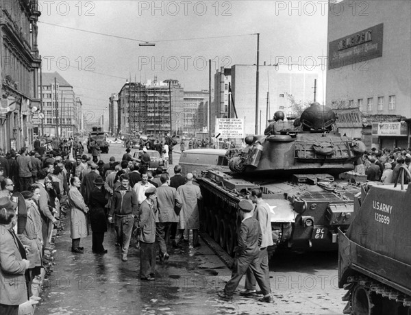 US soldiers and People's Police officers at checkpoint Friedrichstraße in Belrin 1961