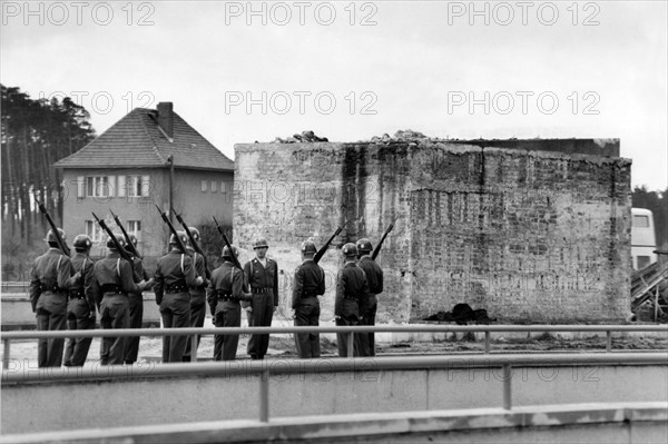 US army observes the plinth of a Soviet tank monument