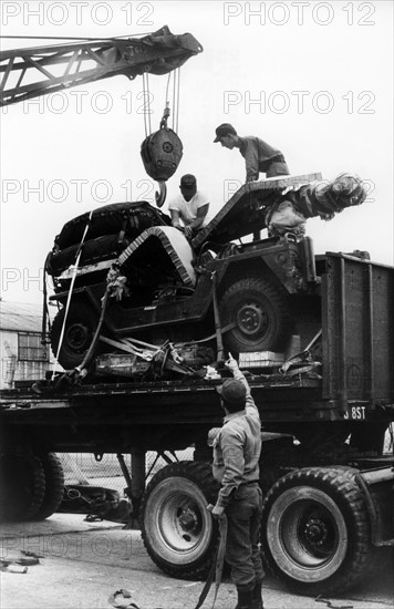 US soldiers load a jeep