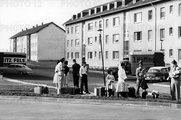 Relatives of the US Army leaving decrepit apartments