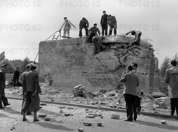 Plinth of the Soviet tank monument at the Potsdamer Chaussee in Berlin is broken up.