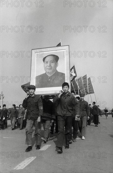 Photo: Chinese People filed through the streets with a portrait of the...
