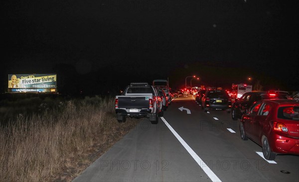 Residents drive to the temporary shelter built for bushfire evacuees near Taree, New South Wales, Australia, Nov. 10, 2019