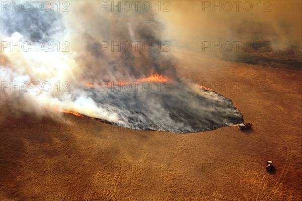 Photo taken on Dec. 20, 2019 shows fire trucks working at Lexton bush fire site in western Victoria, Australia