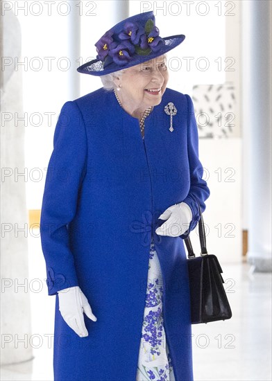 Queen Elizabeth II walks through the Garden Lobby at the Scottish Parliament in Edinburgh ahead of a ceremony marking the 20th anniversary of devolution in the Holyrood chamber. |