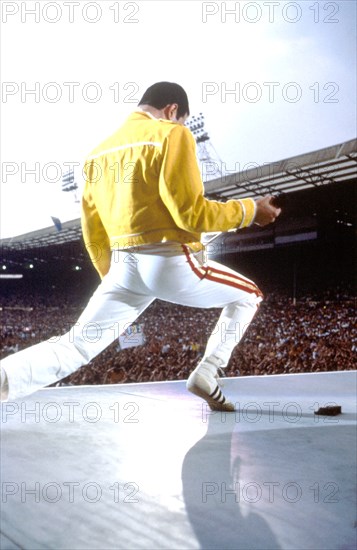 Freddie Mercury of Queen, performing live during the bands 'Magic Tour' at Wembley Stadium in 1986. © Tony Mottram / Retna UK Credit All Uses