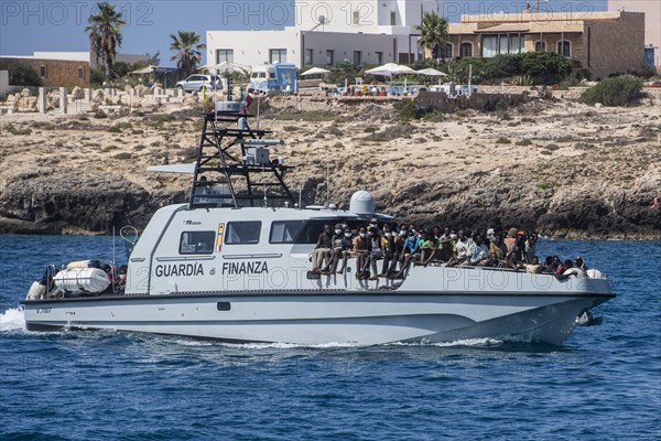 Migrants arriving on Lampedusa Island