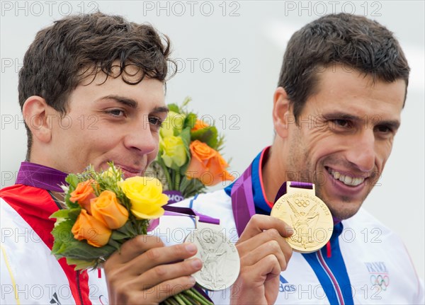 Silver medalist Sideris Tasiadis (L) of Germany and Tony Estanguet of France