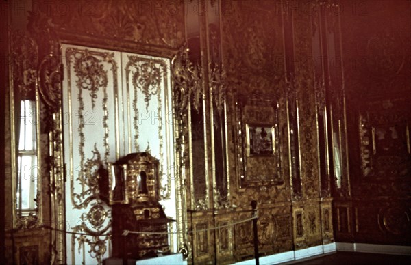 (dpa files) - A photo taken secretly by a German soldier during a visit shows the original Amber Room which was exhibited between 1941 and 1944 at the castle in Kaliningrad, photographed around 1942/43. His pictures are today the only surviving colour photos of the famous amber room. - The Amber Room was a present from Prussia to Russia, offered by the king of Prussia to Russian Czar Peter the Great in 1716. Catherine the Great later moved it from the Winter Palace in St. Petersburg to her new summer abode in Tsarskoye Selo in 1770. When Germany invaded the Soviet Union in 1941, the German troops shipped the amber room to Koenigsberg, Germany (today Kaliningrad). The room was eventually lost in the chaos of World War II. The former Soviet Union began the reconstruction of a replica of the room in 1979. The finishing stage of the project was financed by the German Ruhrgas AG with 3 million Euro. As a work of art the room was considered to be the eighth wonder of the world. The ceremonia...