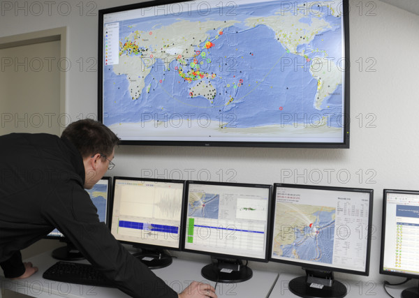 A seismologist watching current readings on the earthquake in Honshu, Japan at the Geological Research Institute in Potsdam, Germany on 11 March 2011