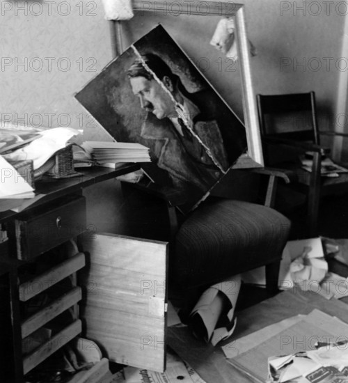 The picture from the Nazi news service shows - in the run-up to the Munich Agreement - the destruction described as "Czech terror" in a office with a Hitler portrait in the Sudetenland, September 1938, location unknown. Photo: Fotoarchiv für Zeitgeschichte/Archive - NO WIRE SERVICE || Mininum fee EUR 40