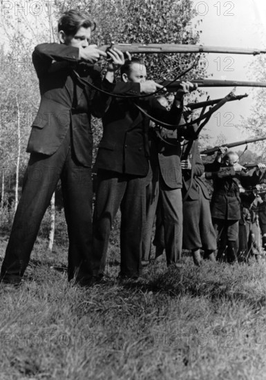 The Nazi propaganda picture shows Sudeten Germany Freikorps during military exercises in the run up to the Munich Agreement in September 1938. The original text from a Nazi news report on the back of the picture reads: "Self help pictures from Sudeten Germany. The self defence groups of the Freikorps, who are arriving everywhere along the German-Czech border, have started with the military training and education of teams with weapons. Our picture shows standing shooting exercises in the area of Hirschfelde near Zittau." Photo: Fotoarchiv für Zeitgeschichte/Archive - NO WIRE SERVICE pixel || Mininum fee EUR 40