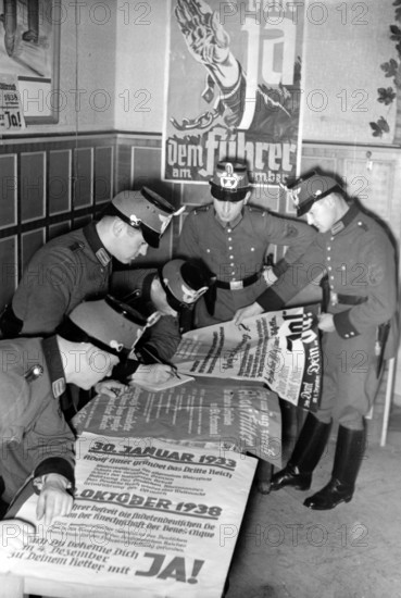 The Nazi propaganda picture shows how Nazi election posters are prepared for the Parliamentary elections on 4 December 1938 in a police office in the Sudetenland. The photo was taken in November 1938. Photo: Fotoarchiv für Zeitgeschichte/Archive - NO WIRE SERVICE - || Mininum fee EUR 40