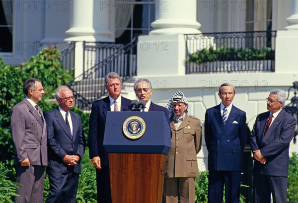 Minister of Foreign Affairs of Israel Shimon Peres makes remarks during the signing ceremony of the historic Israeli-PLO Agreement, known as the Oslo 1 Accord, on the South Lawn of the White House in Washington, DC on September 13, 1993. Pictured, from left to right: From left to right are: Foreign Minister Andrei Kozyrev of Russia; Prime Minister Yitzhak Rabin of Israel; United States President Bill Clinton; Peres; Chairman Yasser Arafat of the Palestine Liberation Organization (PLO); US Secretary of State Warren Christopher; and Arafat aide Mahmoud Abbas. Credit: Arnie Sachs / CNP