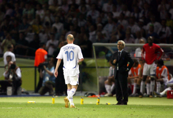 French Zinedine Zidane (L) walks off the pitch after being red-carded next to his coach Raymond Domenech during the 2006 FIFA World Cup Final Italy vs France at the Olympic Stadium in Berlin, Germany, Sunday 09 July 2006. DPA/ROLAND WEIHRAUCH +++ Mobile Services OUT +++ Please refer to FIFA's Terms and Conditions. +++(c) dpa - Report+++