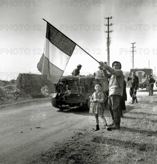 WW II, historical, war, world war, second world war, operation Overlord, Overlord, invasion, French, veteran, flag, banner, Canadian, troop transportation vehicles, Saskatchewan regiment, 2nd Canadian Infantry division, June, 1944, Fleury-sur-Orne, allies, Allied Forces, D-Day, Caen, Normandy, France, Europe,