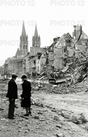 WW II, historical, war, world war, second world war, operation Overlord, Overlord, invasion, older, elder, married couple, civilian, Canadian, bulldozer, destruction, ruins, houses, homes, Rue de Bayeux, July, 1944, steeples, allies, Allied Forces, bomb attacks, Caen, Normandy, France, Europe,