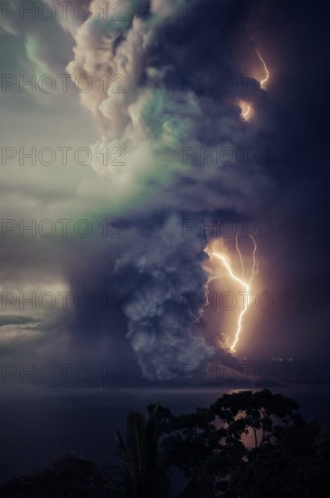 The billows of smoke with lightning is seen from the eruption of the volcan island Taal .The Taal Volcano in the central Philippines boomed to life on Sunday, spilling ash and warned evacuations in nearby communities -- and officials warn that a more powerful eruption is imminent. Tall Volcano is located on the island of Luzon and is the country's second most active volcano. (Photo by Hero Robles / Pacific Press)
