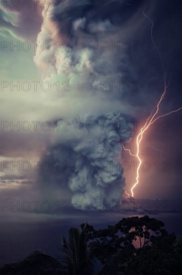 The billows of smoke with lightning is seen from the eruption of the volcan island Taal .The Taal Volcano in the central Philippines boomed to life on Sunday, spilling ash and warned evacuations in nearby communities -- and officials warn that a more powerful eruption is imminent. Tall Volcano is located on the island of Luzon and is the country's second most active volcano. (Photo by Hero Robles / Pacific Press)