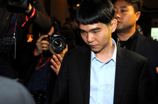 (160309) -- SEOUL, March 9, 2016 () -- South Korean professional Go player Lee Sedol leaves after after the the Google DeepMind Challenge Match against Google's artificial intelligence program, AlphaGo, in Seoul, South Korea, March 9, 2016. Lee Sedol lost the first match. (Xinhua/Gang Ye)