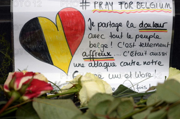 Flowers and messages of condolence laid outside the Belgian embassy in Berlin, Germany, 23 March 2016. At least 31 people were killed and more than 270 injured in terror attacks on 22 March in Brussels, Belgium. PHOTO: BRITTA PEDERSEN/DPA