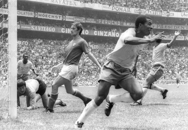 Brazilian international football player Jairzinho (front) is celebrating his 3:1 goal during the final match of the 1970 FIFA World Cup against Italy (4:1) on June 22nd 1970 in Mexico City. Goalkeeper Enrico Albertosi (on the ground) is left with nothing.