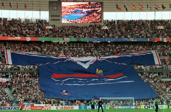 French supporters unfold a giant French national team jersey which spans across the stands just before the start of the 1998 World Cup semifinal France against Croatia at the Stade de France in Saint Denis, Paris, France, 8 July 1998. France won the game 2-1 against Croatia and qualified for the world cup final against titleholder Brazil.
