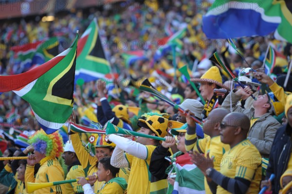 Fans celebrate during the opening ceremony of the 2010 FIFA World Cup at Soccer City stadium in Johannesburg, South Africa 11 June 2010. Photo: Ronald Wittek dpa - Please refer to http://dpaq.de/FIFA-WM2010-TC